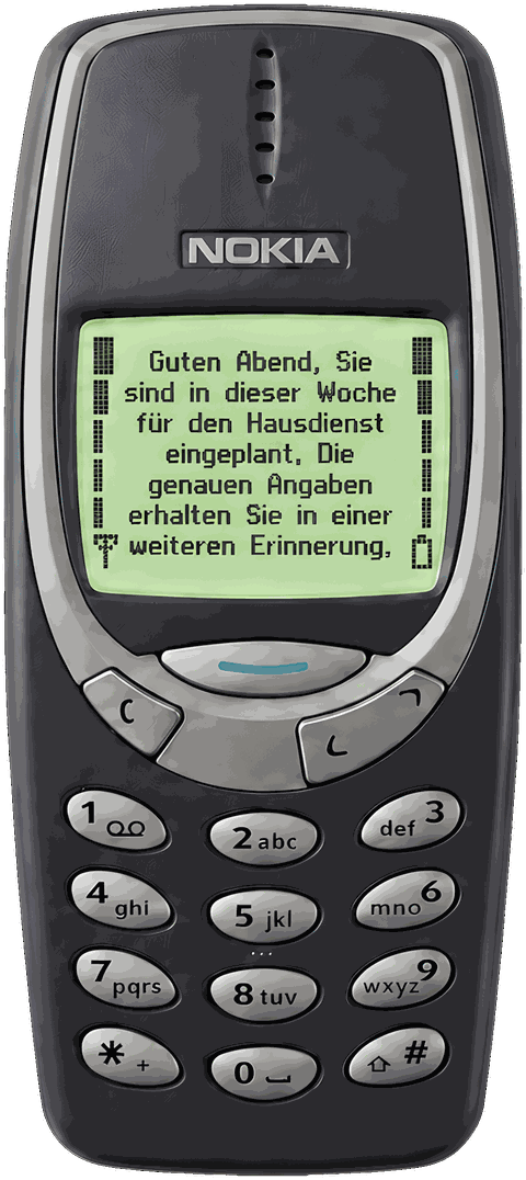 Ein Tastenhandy zeigt dieselbe Erinnerung als kurze SMS. Auch ohne Smartphone kommt sie an.